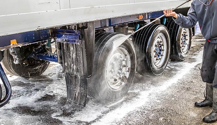 A person power washing fleet vehicle