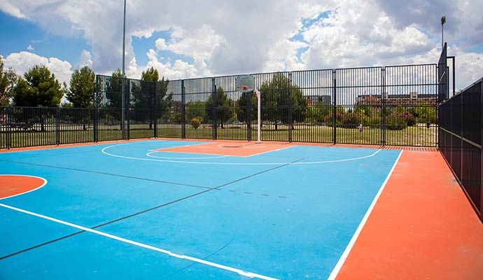 Colorful outdoor basketball court with vibrant markings
