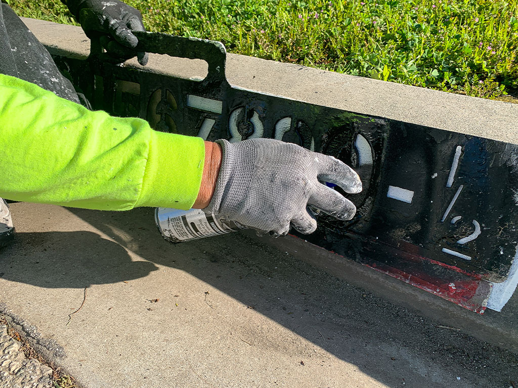 Curb address painting with stencil