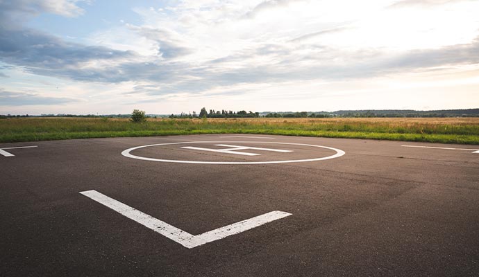 Heliport pavement marking with white H symbol