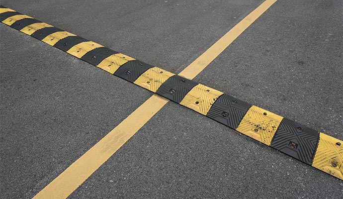 Painted industrial parking lot speed bump