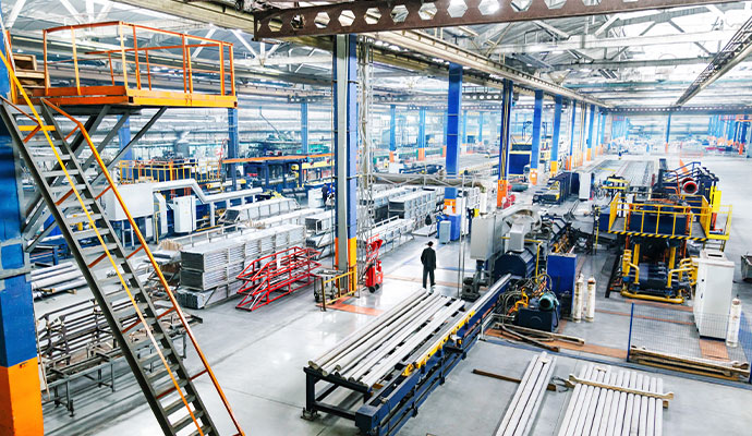 Interior of a large-scale manufacturing facility with machineries