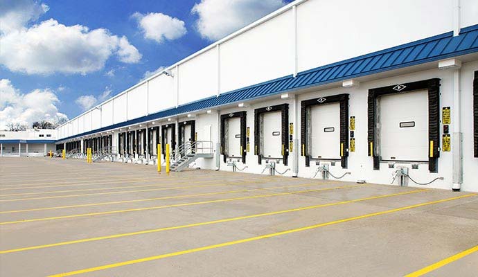 Commercial warehouse loading dock bays with yellow painted guide lines