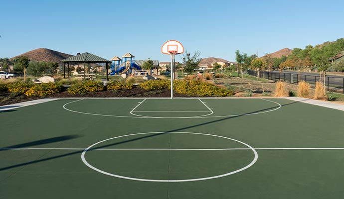 Outdoor basketball court with fresh white striping