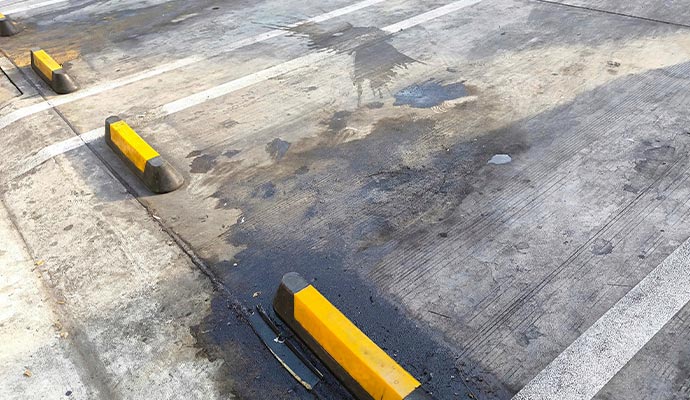 Oil stains split on parking lot