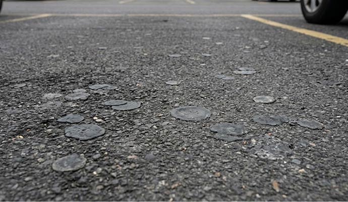 Parking-lot with visible chewing gum spots