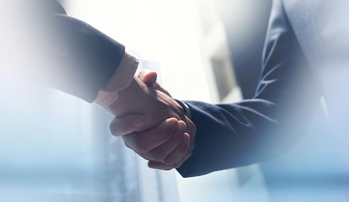 Two partners are shaking hands