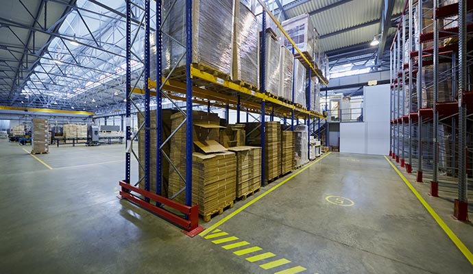 Yellow stripped floor of an organized warehouse